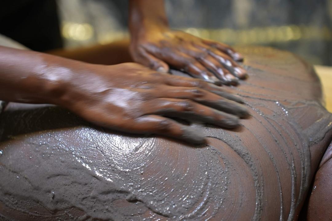 Moroccan Hammam body polish treatment in progress.